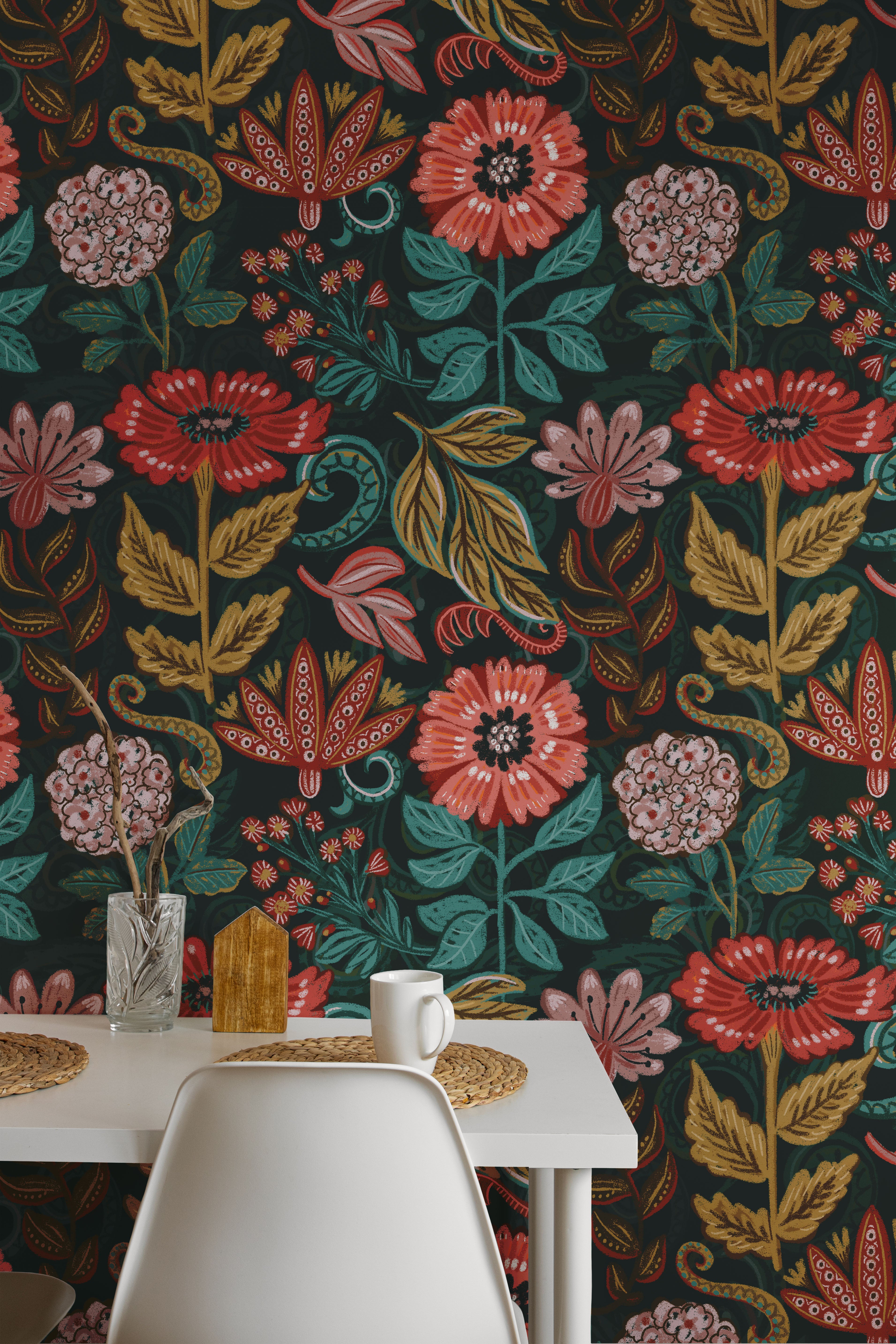 Floral wallpaper with vibrant colors in a room with a table and chairs.